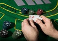 Winning combination in poker game. Cards and chips on a green cloth Royalty Free Stock Photo