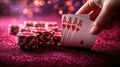 Winning hand of four aces and poker chips on sparkling table Royalty Free Stock Photo