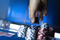 Winning man stacking chips on the poker table Royalty Free Stock Photo
