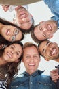 Winning with our positive attitude. Cropped low angle shot of six people putting their heads together in a circle. Royalty Free Stock Photo