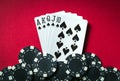 A winning poker combination is Royal Flush. Chips and cards on the red table in the poker club. Luck or Fortune Royalty Free Stock Photo