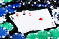 A winning poker hand of four aces playing cards suits on black background with poker chips Royalty Free Stock Photo