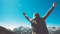 Winning and success. Victorious female person on mountain top. Royalty Free Stock Photo