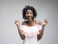 Winning success woman happy ecstatic celebrating being a winner. Dynamic energetic image of female afro model Royalty Free Stock Photo