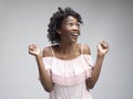 Winning success woman happy ecstatic celebrating being a winner. Dynamic energetic image of female afro model Royalty Free Stock Photo