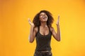 Winning success woman happy ecstatic celebrating being a winner. Dynamic energetic image of female afro model Royalty Free Stock Photo