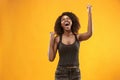 Winning success woman happy ecstatic celebrating being a winner. Dynamic energetic image of female afro model Royalty Free Stock Photo