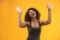 Winning success woman happy ecstatic celebrating being a winner. Dynamic energetic image of female afro model Royalty Free Stock Photo