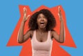 Winning success woman happy ecstatic celebrating being a winner. Dynamic energetic image of female afro model Royalty Free Stock Photo