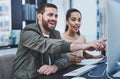 A winning team always works as one. two young designers working together on a computer in an office. Royalty Free Stock Photo