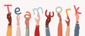 Group of arms and raised hands of diverse multicultural business people holding a letters forming the text -Teamwork- Community Royalty Free Stock Photo