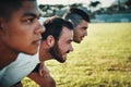 Winning is their goal. a group of three young rugby players lining up for a scrum on the field during the day. Royalty Free Stock Photo