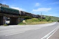 Winningen, Germany - 07 12 2022: Waterfront road with a fast running freight train next to it