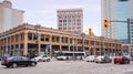 Winnipeg, Manitoba, Canada - 11 17 2014: Traffic on Portage avenue in front of historical Curry Building erected in 1915