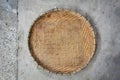 Bamboo winnowing basket on cement floor background Royalty Free Stock Photo