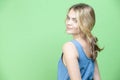 Winsome Caucasian Blond Girl In blue suite Posing In Summer outfit While looking Backwards With Positive Expression Over Summer Royalty Free Stock Photo