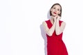 Winsome Concentrated Confident Caucasian Business Woman in Red Dress Posing In Provocative Pose With Black Purse On White