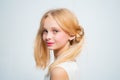 Wintage teen style. Happy blond teenager girl. Skincare and natural makeup for retro blonde teen. Beauty hairdresser Royalty Free Stock Photo