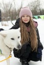 outdoor season friendship husky winter woman adult young girl animal snow dog pet person park