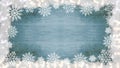 Winter / Advent / Christmas / holiday Background template - Frame made of snow with snowflakes, ice crystals on blue  wooden Royalty Free Stock Photo