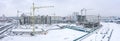 Winter aerial panoramic view of big construction site in residential district Royalty Free Stock Photo