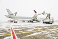 Winter at the airport. Snow storm. Airplane de-icing before take off. De-icing the aircraft before the flight. The de