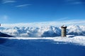 Winter alpine mountain scene under a blue sky
