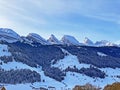 Winter alpine snow peaks of the Churfirsten mountain range between Lake Walenstadt or Lake Walen Walensee and the Thur valley Royalty Free Stock Photo