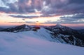 Winter. Amazing sunrise. A panoramic view of the covered with snowy mountain peak. Natural landscape with beautiful sky. Location Royalty Free Stock Photo