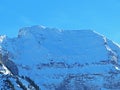 Winter ambience and beautiful idyllic atmosphere on the steep alpine rocky peak LÃÂ¼tispitz or Luetispitz / 1986 m.a.s.l.