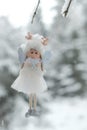 Winter angel.Christmas and New Years time.Christmas angel on a tree. Snow fairy