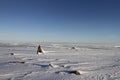 Winter arctic landscape with a small Inukshuk Royalty Free Stock Photo