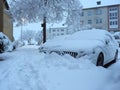 Winter attack in Germany. Heavy snowfall in NRW in the Mettmann county. Snow-covered roads and cars.