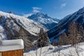 Winter aura in the Alps, beautiful view of the cottage - mountains, trees in snow, Mont Blanc du Tacul, Chamonix, France Royalty Free Stock Photo