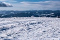 Winter austrian mountain ranges panorama with blue sky and clouds