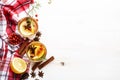 Winter autumn warming hot tea with lemon, cranberries and spices, white background, copy space, top view