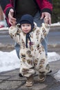 Winter baby walking Royalty Free Stock Photo