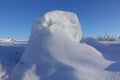 Winter background. Abstract. Snow drifts on the background of blue clear sky, smooth transitions of lines of light and shadow. Royalty Free Stock Photo