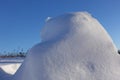 Winter background. Abstract. Snow drifts on the background of blue clear sky, smooth transitions of lines of light and shadow. Royalty Free Stock Photo