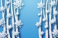 Winter background in blue tones, voluminous snowflakes and trees cut from paper, in layers. Royalty Free Stock Photo