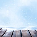 Winter background for Christmas design. Wooden surface made of boards and snowdrifts. Snow fall. Copy space. Square format.