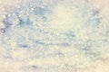 Winter background. Christmas snow landscape with snowdrifts and spruce branches. Falling sparkles and lights bokeh closeup. Mixed