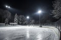 Winter background with empty lit ice rink and spotlights Royalty Free Stock Photo