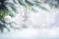 Winter background. Pine tree branches with Christmas ornament. Falling snow effect Royalty Free Stock Photo