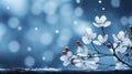 Winter background in shades of blue with snow, snowflakes, snow-covered tree branches and red berries.