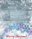 Winter Background with Snowflake Wreath on Frozen Wood Textured Surface.