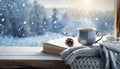 Winter background. tea cup, book, sweater and winter frozen window. cozy mood, home comfort in snowy cold weather Royalty Free Stock Photo