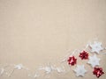 Winter background with three star-shaped candles, a white ribbon with wooden carved hearts and red stars made of ribbons Royalty Free Stock Photo