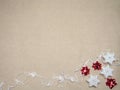 Winter background with three star-shaped candles, a white ribbon with wooden carved hearts and red stars made of ribbons Royalty Free Stock Photo