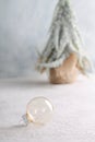 Winter background with a transparent glass ball. Royalty Free Stock Photo